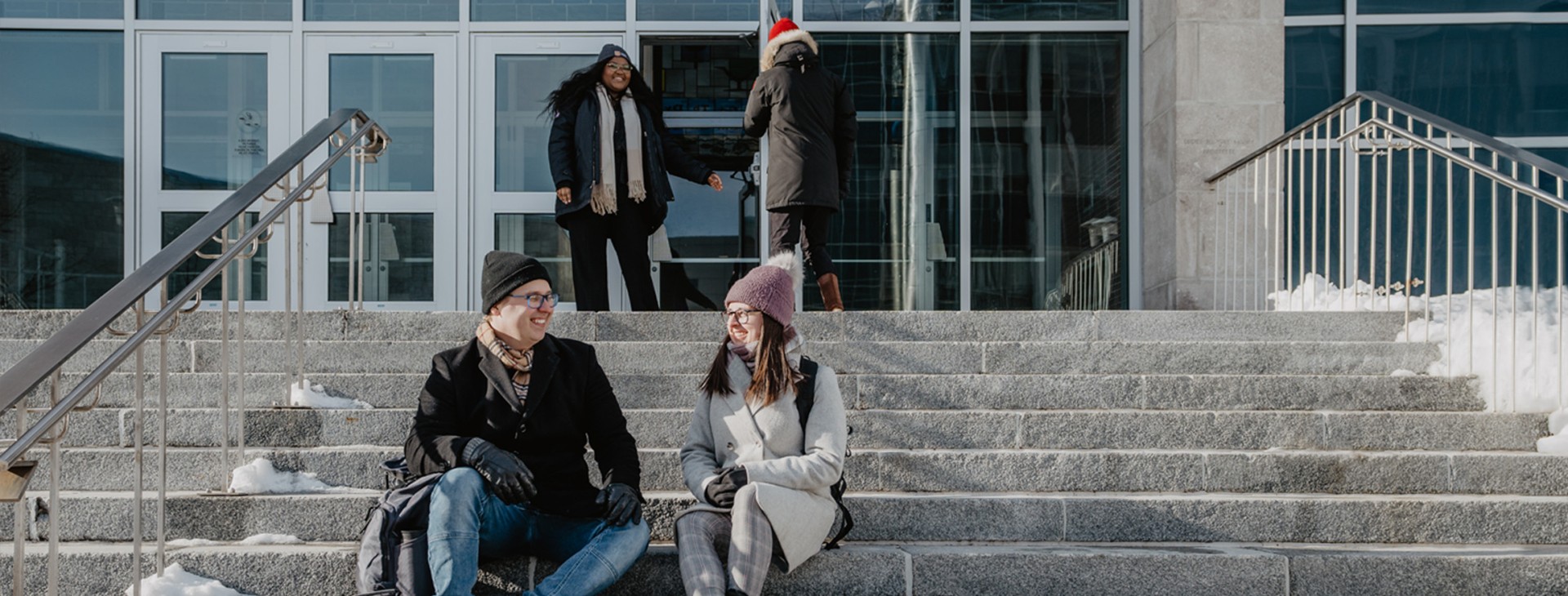 Students sitting in stairs