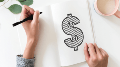 Signe du dollar sur un livre